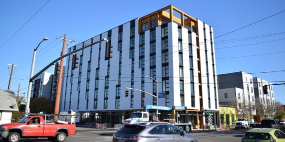 Multistory, white building, modern in design - development for PCEF funding