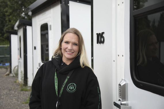Kathy wears a black hoodie with the logo to the non-profit Urban Alchemy, which helps the homeless