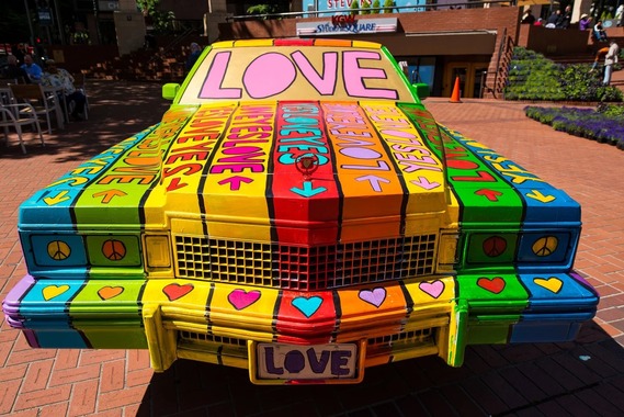 ARTS - Car painted by Larry Yes with "Love" painted in a rainbow assortment of colors. Photo by Rachel Houghton.