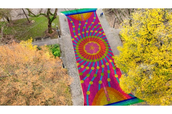 Aerial artist rendering of a colorful street mural in the Cultural District Plaza