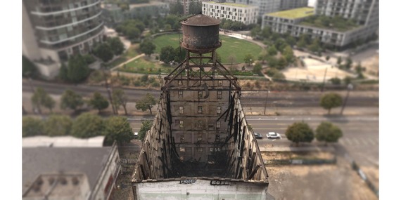 Aerial view of a burnt out, nine-story building formerly the Centennial Mills