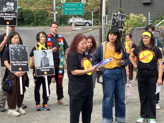 Group of people holding signs reading "Stop Repeating History," "No More U.S. Concentration Camps" and "Not OK in 1942! Not OK Now!"