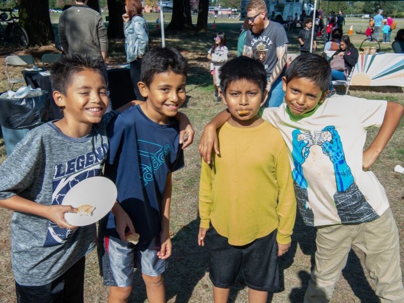 Four young boys smiling