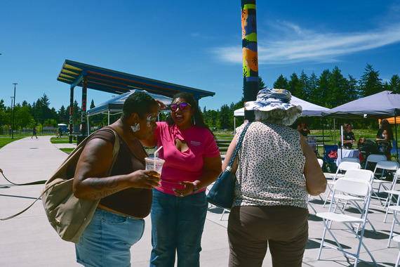 Councilor Avalos laughs with two East Portland constituents