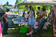 People eating at the D1 People's Picnic