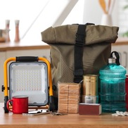 A backpack and emergency supplies that represent a "go kit" that helps in preparedness