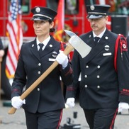 Firefighters in ceremonial uniforms commemorate 9/11