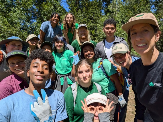 Vivian Satterfield, Chief Sustainability Officer, and a group of high school students in Youth Conservation Crew