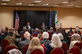 Treasurer on stage at City Club