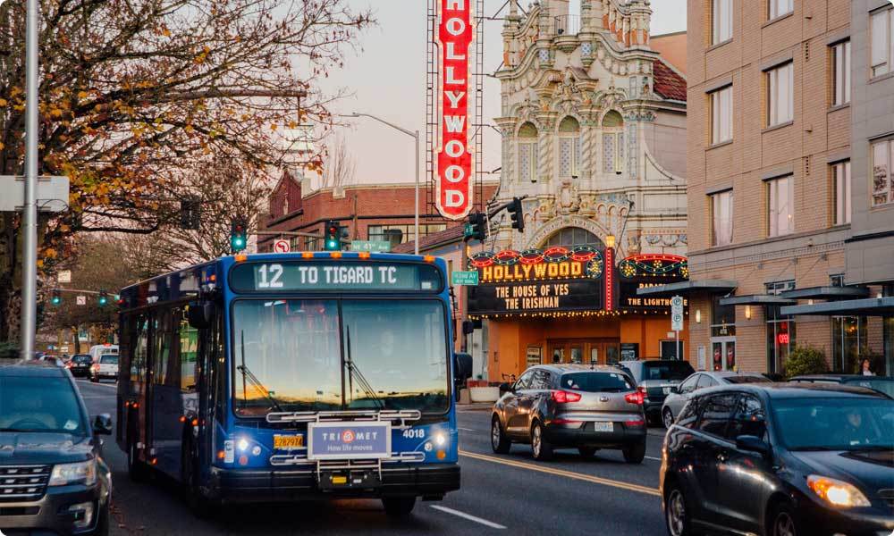 Bus driving by the Hollywood Theater