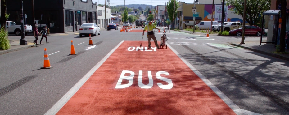 Red bus lane being painted on SE Hawthorne