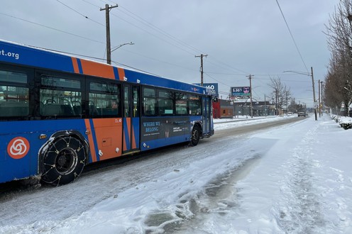 2 23 23 snow event bus with chains in snow