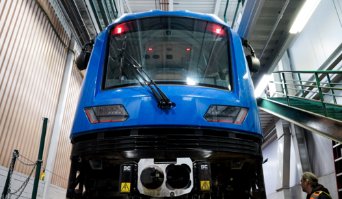 Type 6 trains, image looking up at the front of a new blue Type 6 light rail train. 