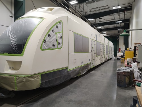 A white Type 4 MAX train before it gets painted