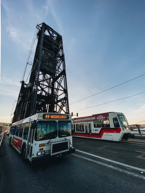 TriMet bus and MAX train on the Steel Bridge on a clear day