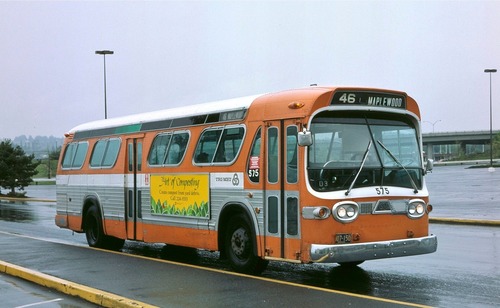 A retro orange TriMet bus from the 80s with route "46 - Maplewood" signage