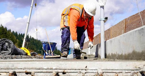 Construction worker works with a shovel 
