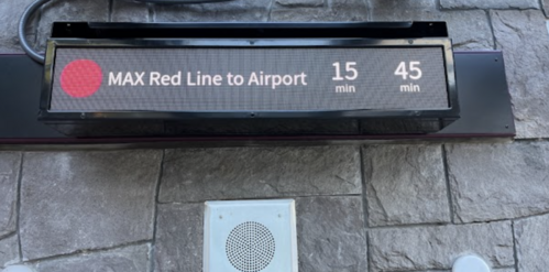 A digital sign showing the arrival time for MAX Red Line