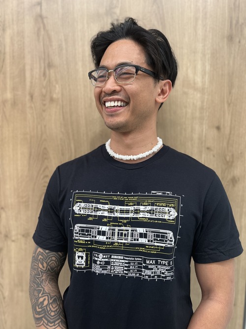 Man smiling and wearing a T-shirt with a Type 6 train on it