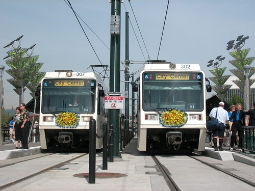 Two Yellow Line MAX trains side by side