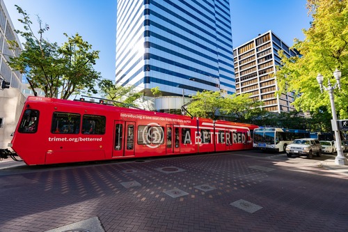 A train wrapped in red and with "A Better Red" lettering