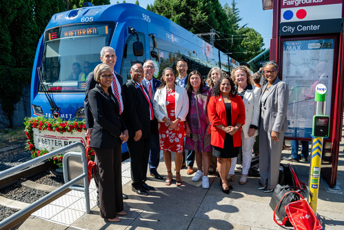 TriMet General Manager Sam Desue Jr. and dignitaries attend the Official Opening Ceremony for A Better Red, alongside a Type 6 MAX train.