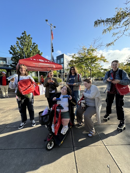 Group of friends at the Better Red opening showing their squishy trains