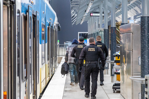 Transit Police carry out a law enforcement mission at the Portland Airport MAX Station.
