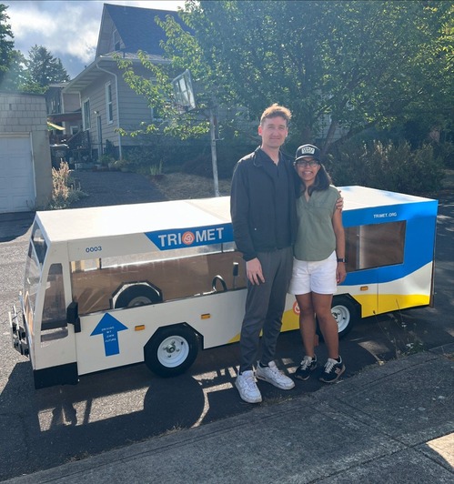 Soap box bus with a "Mt. Tabor" sign sitting in front of a house