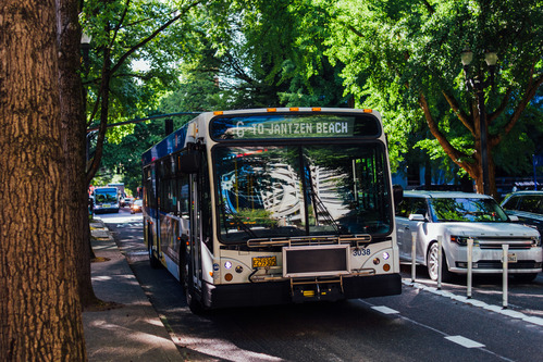 Image of a TriMet Line 6 bus on the road in Northeast Portland