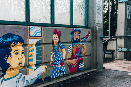This is a photo of the 82nd Avenue MAX Station's entrance. It shows the mural that's located at the station entrance. 