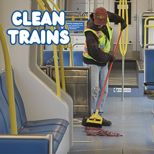 TriMet employee mopping the floor of a MAX train