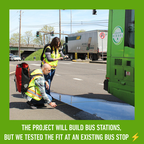 two workers measuring the fit of an FX bus at an existing bus stop