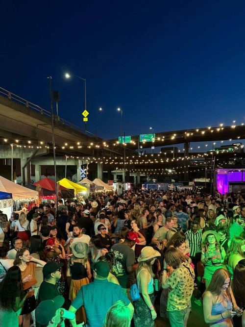 A lively crowd enjoys a summer night at the Portland Night Market