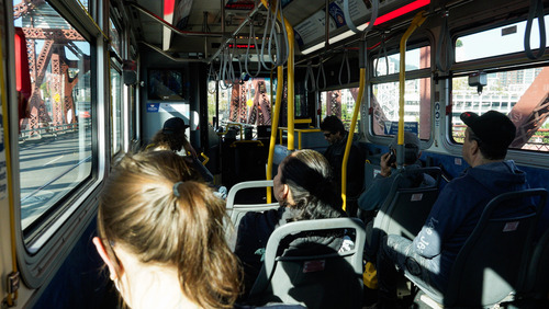 Image of a TriMet bus interior filled with riders on the Broadway Bridge