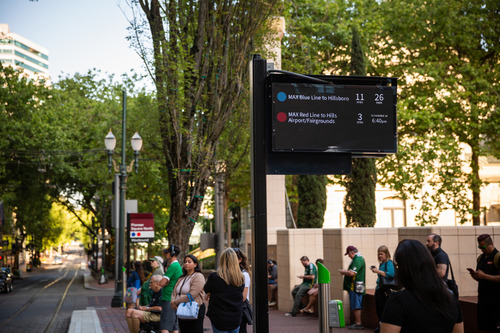 A downtown MAX stop with a digital display