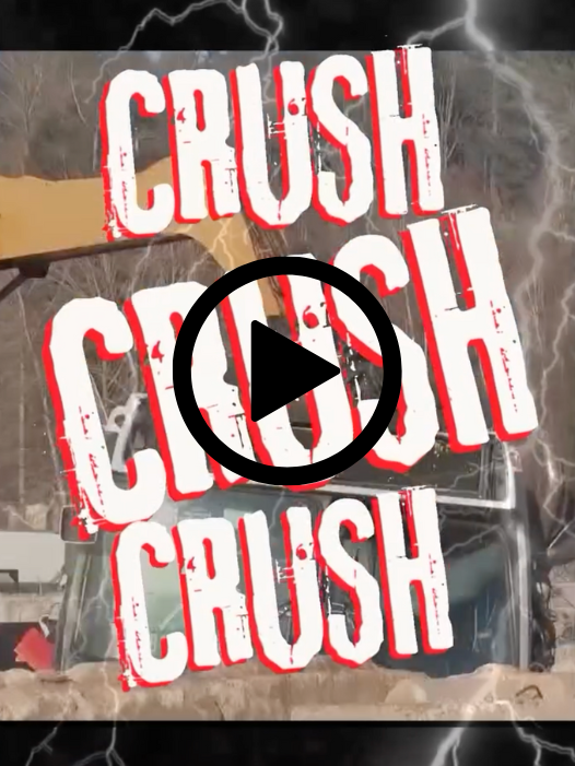 bus getting crushed at a recycling center