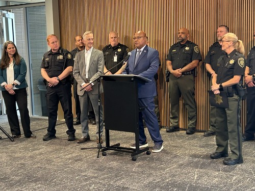 Image of TriMet General Manager Sam Desue Jr. speaking at TriMet's Public Safety Office alongside other local officials