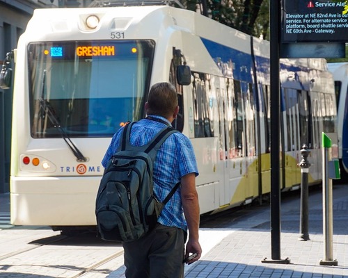 Rider approaching MAX train in Downtown Portland