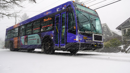 TriMet Line 70 bus drives through snow in Northeast Portland