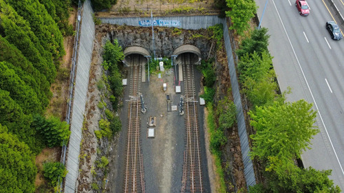 Overhead view of entrances to TriMet's Robertson Tunnel, a twin-tube rail tunnel used by the MAX Blue and Red lines in between Portland and Beaverton