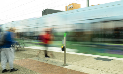 Motion blur of a TriMet MAX train passing through Gateway Transit Center
