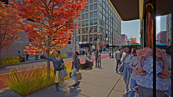A group of people along a tree-lined and landscaped Smithfield Street facing towards the intersection of Smithfield and Fifth Avenue