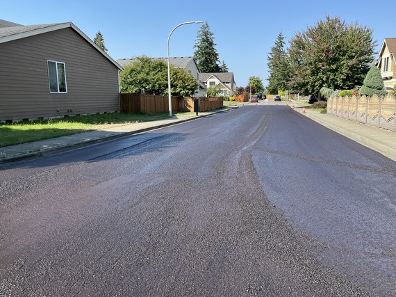 a road with slurry seal treatment completed
