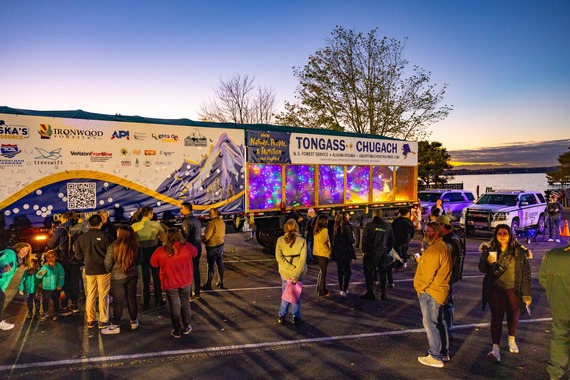 Crowds gathered around the U.S. Capitol Christmas Tree at Gene Coulon Memorial Beach Park during sunset