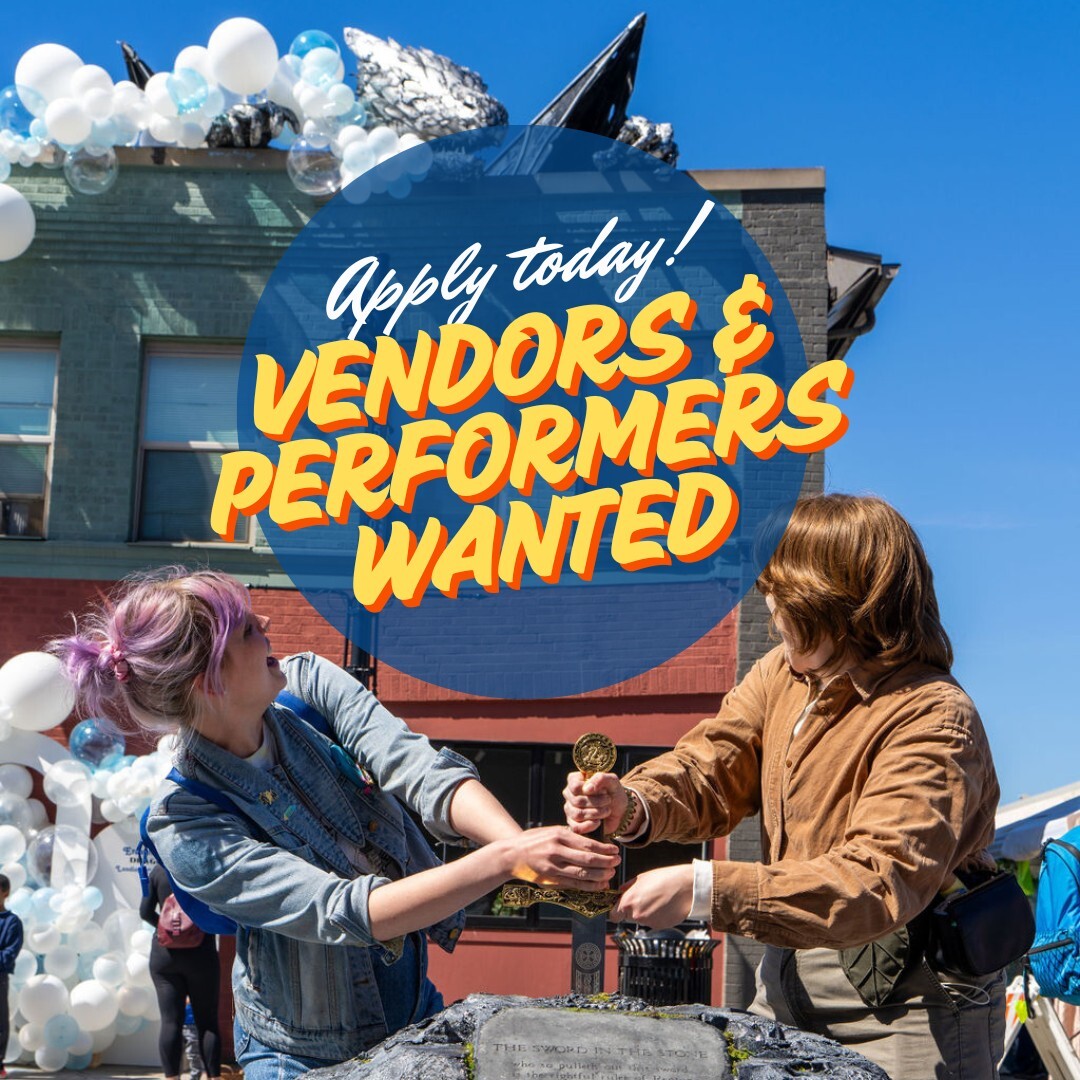Two people posing with the Renton rooftop dragon in the background. Center text says Apply today! Vendors and performers wanted.