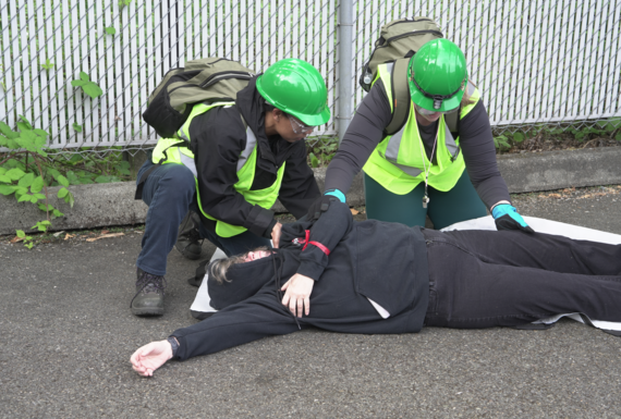 Emergency drill of CERT helping a volunteer acting injured