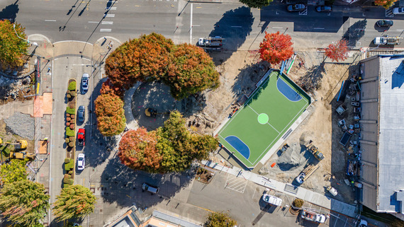 Top down view of the future Legacy Square park , shows trees and the futsal court