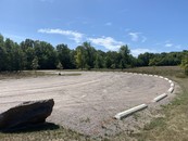 parking lot with cement tire stops for parking