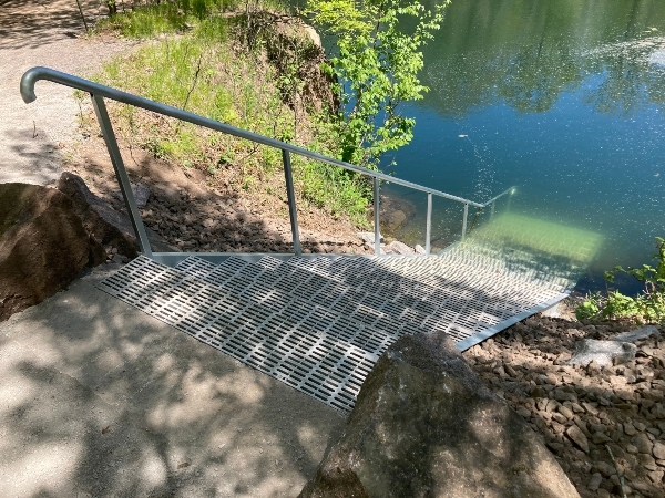 steps going down into a quarry filled with water